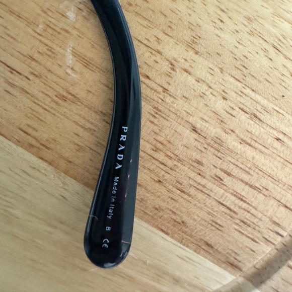 Black round Prada sunglassess with ornate arms. - Picture 3 of 5